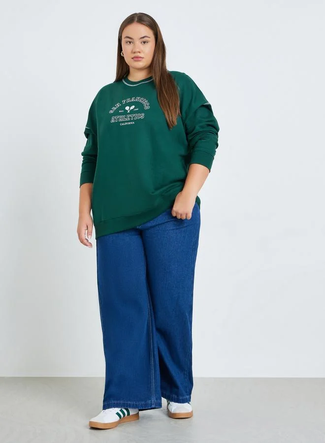 ستايلي سويت شيرت واسع بمقاس كبير وطبعة كتابة